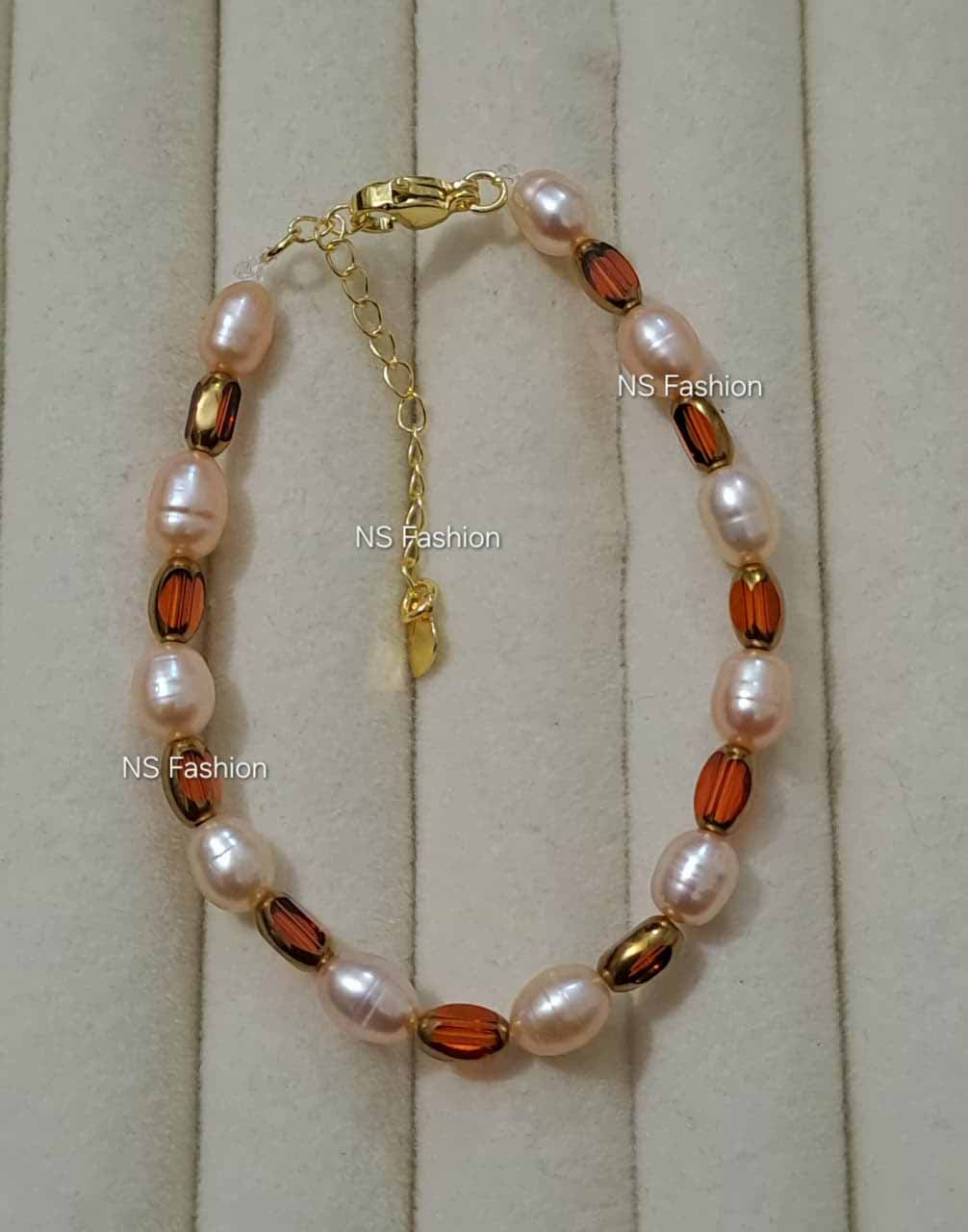 pink-color-rice-pearl-and-stone-bracelet Pink Color Rice Pearl and Stone Bracelet - Image 1